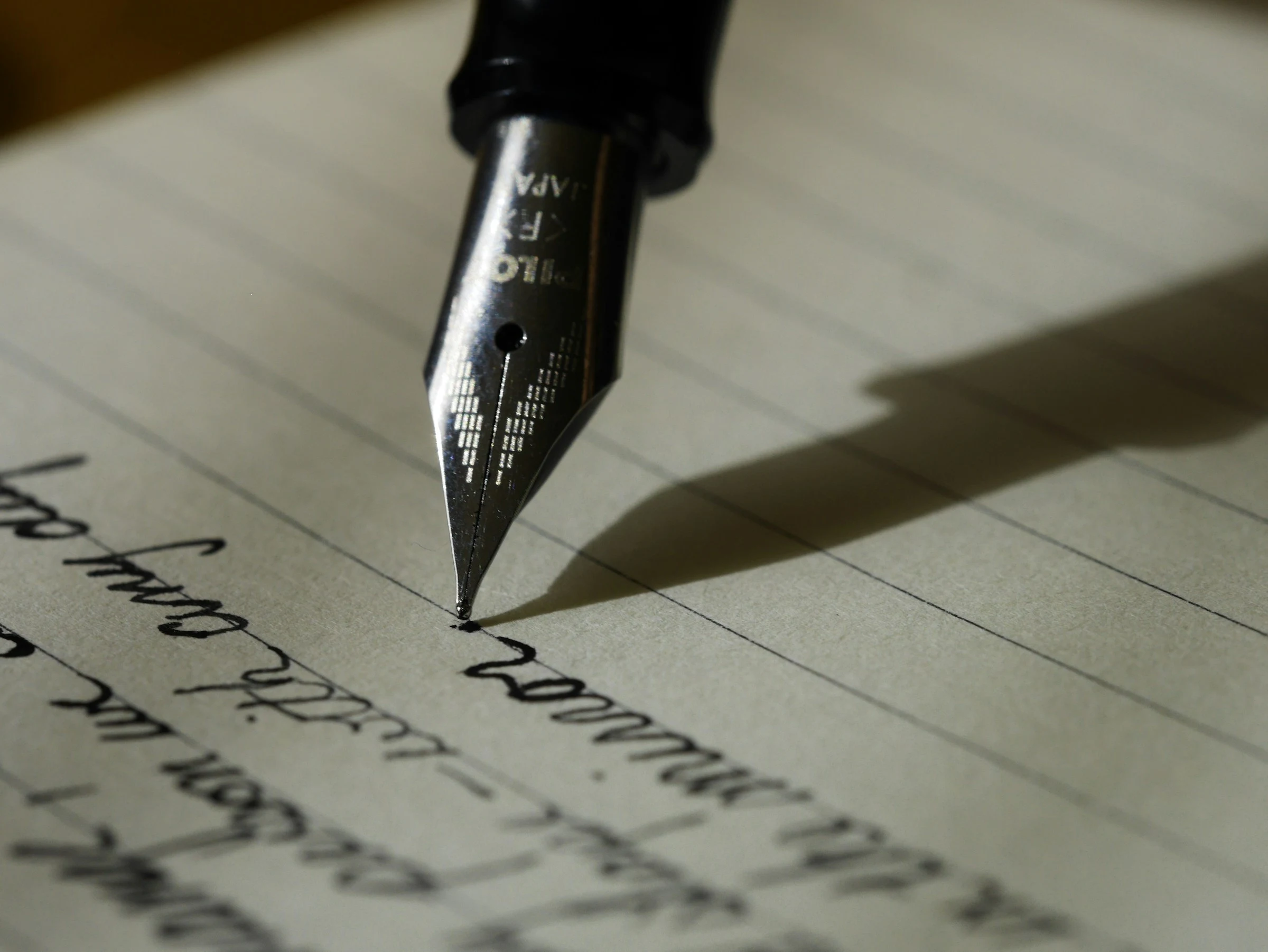 A fountain pen writing on paper
