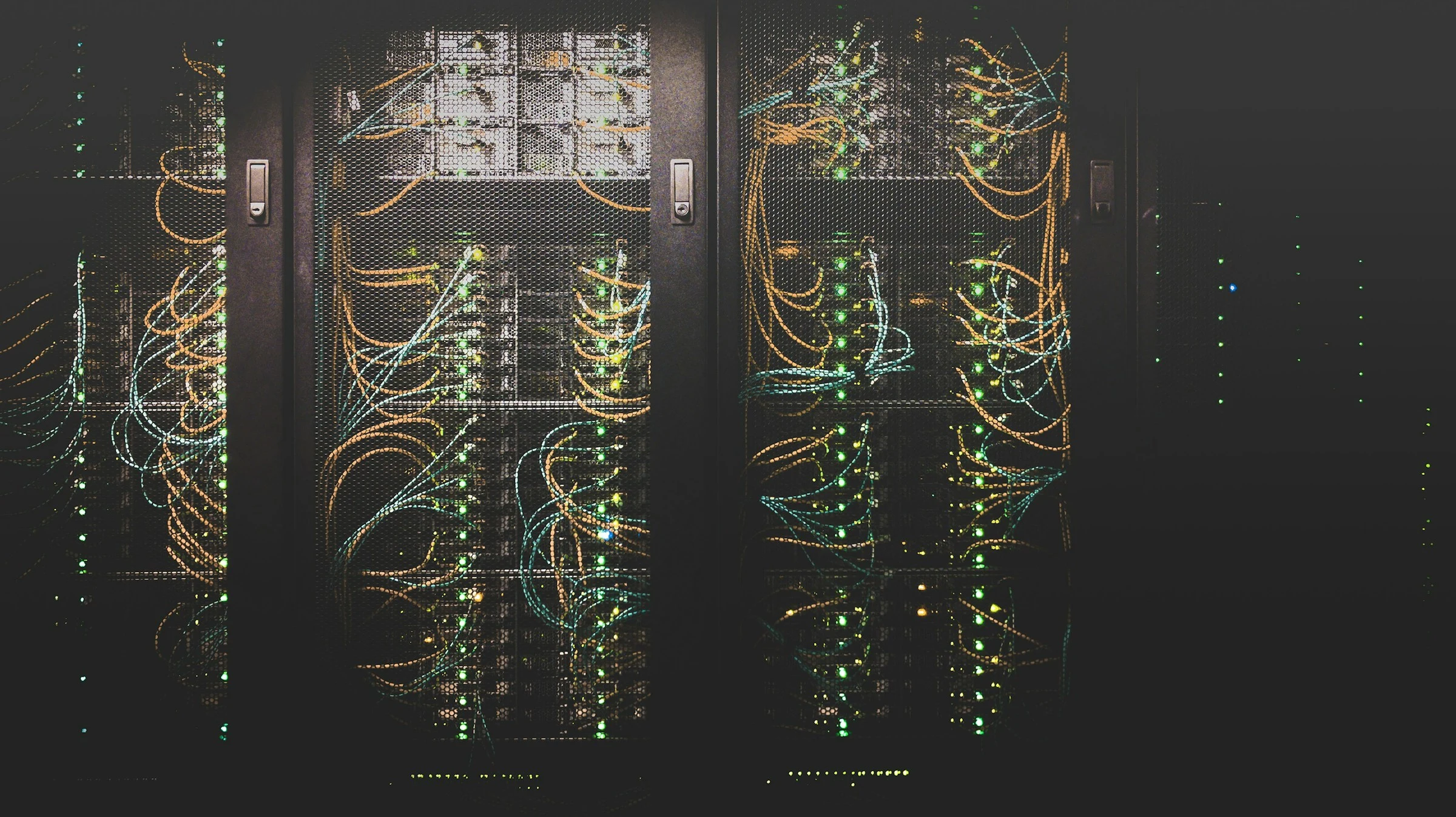 Rows of servers and network connections inside a data centre.