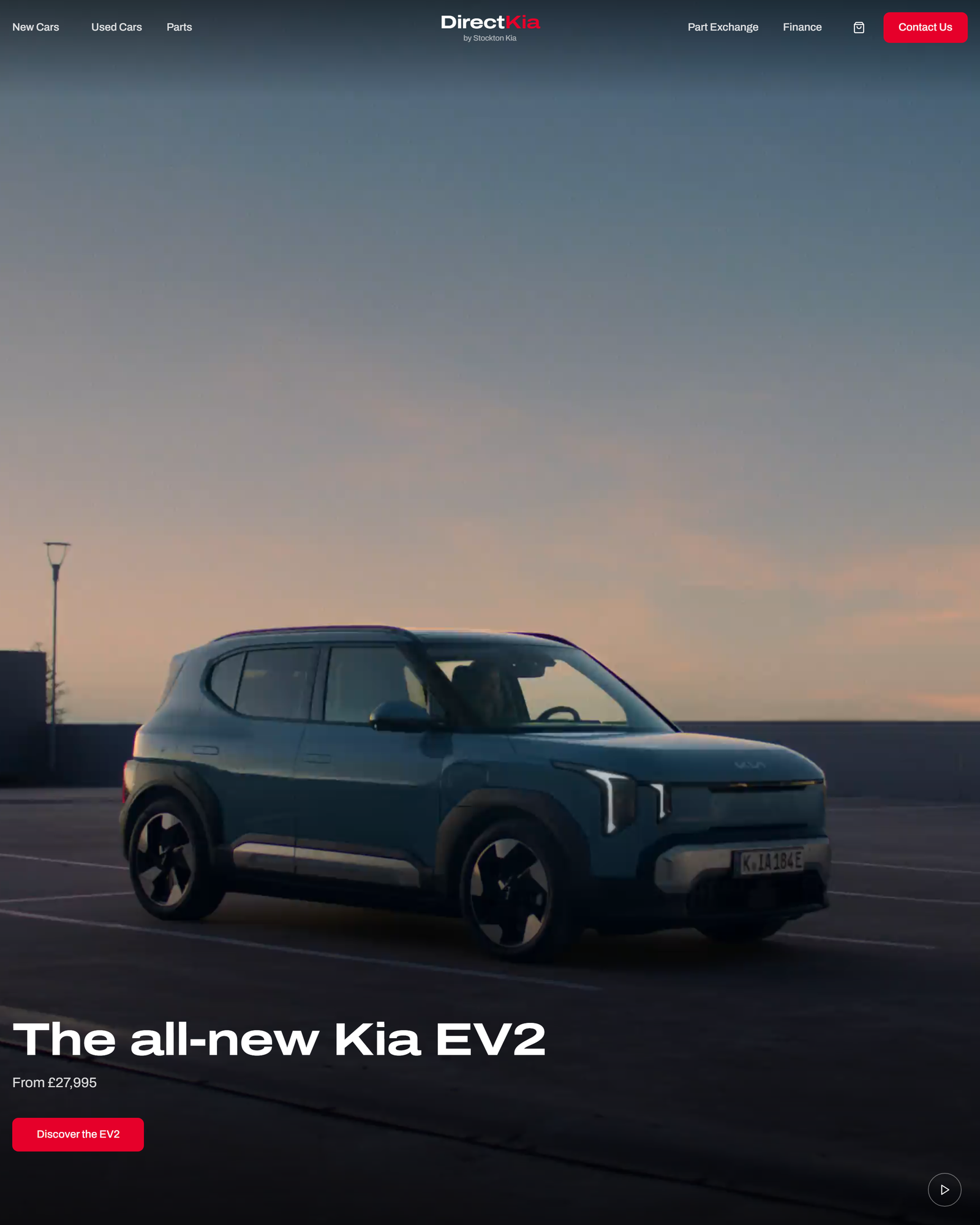 Direct Kia's website campaign for the all-new Kia EV2, photographed at dusk.